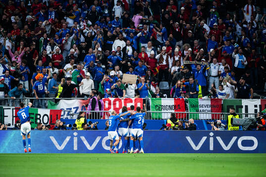 Alessandro Bastoni of Italy celebrates with team mates