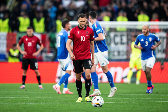 Nedim Bajrami of Albania looks dejected