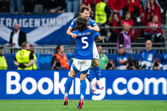 Nicolo Barella of Italy celebrates with Riccardo Calafiori