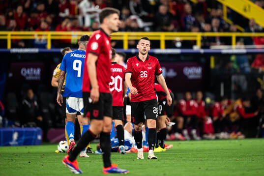 Arber Hoxha of Albania looks dejected