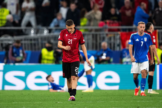 Kristjan Asllani of Albania looks dejected