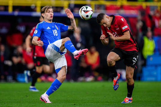 Nicolo Barella of Italy and Kristjan Asllani of Albania