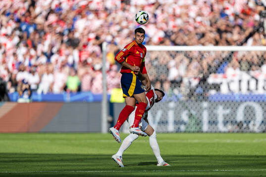 Josip Sutalo of Croatia and Alvaro Morata of Spain