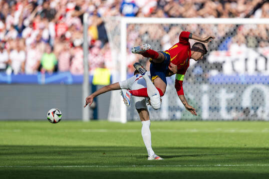 Josip Sutalo of Croatia and Alvaro Morata of Spain