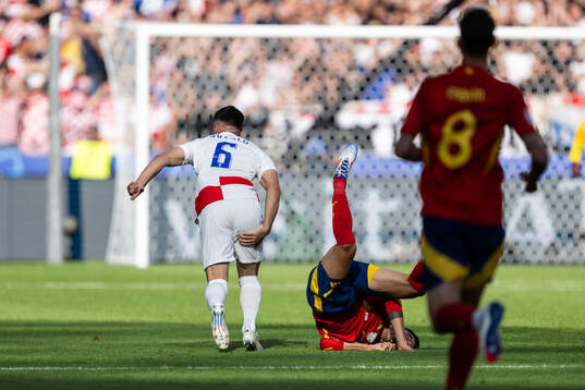 Josip Sutalo of Croatia and Alvaro Morata of Spain