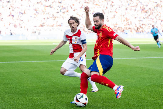 Luka Modric of Croatia and Nacho of Spain