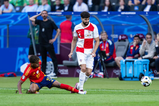 Lamine Yamal of Spain and Josko Gvardiol of Croatia