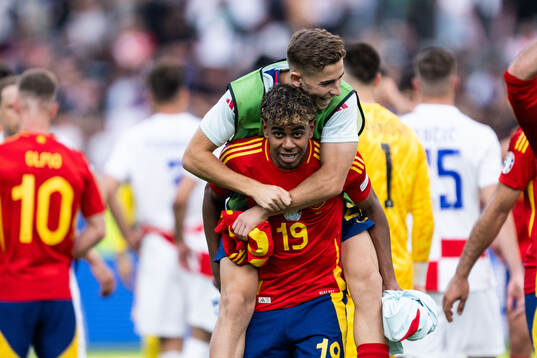 Lamine Yamal and Fermin Lopez Marin of Spain celebrate