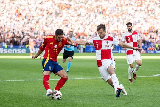 Ferran Torres of Spain and Marin Pongracic of Croatia