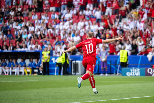 Christian Eriksen of Denmark celebrates