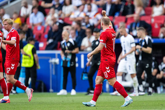 Christian Eriksen of Denmark celebrates