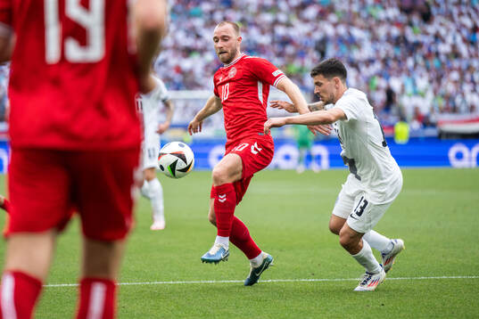 Christian Eriksen of Denmark and Erik Janza of Slovenia