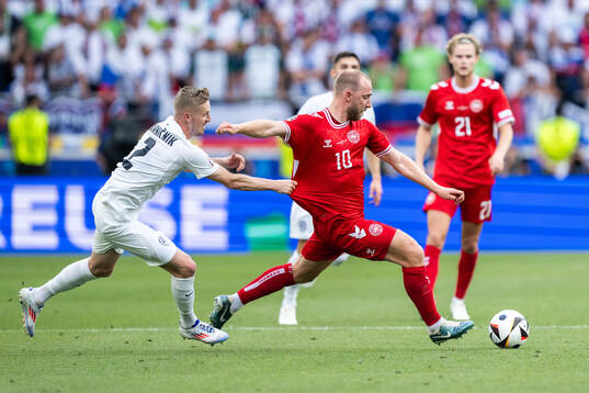 Zan Karnicnik of Slovenia and Christian Eriksen of Denmark