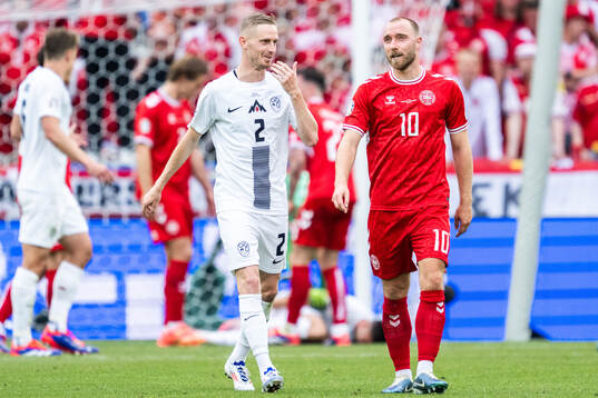 Zan Karnicnik of Slovenia and Christian Eriksen of Denmark