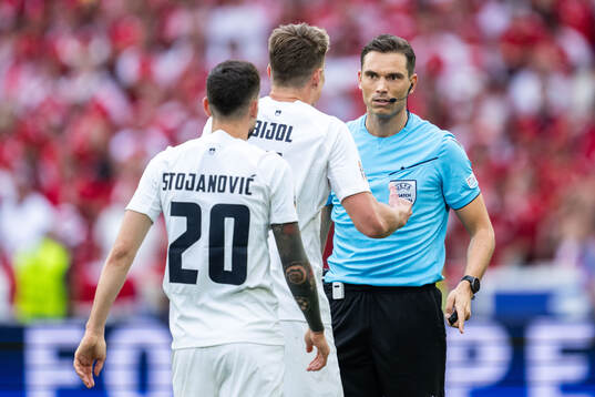 Petar Stojanovic and Jaka Bijol of Slovenia reacts towards