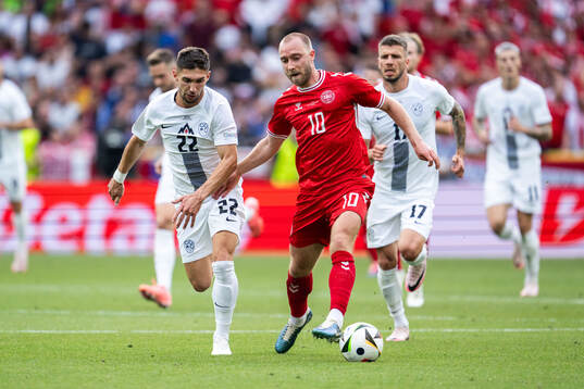 Adam Cerin of Slovenia and Christian Eriksen of Denmark