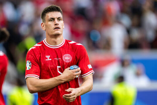 Joakim Mæhle of Denmark looks dejected