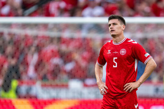 Joakim Mæhle of Denmark looks dejected
