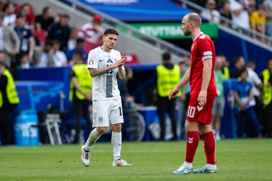 Erik Janza of Slovenia and Christian Eriksen of Denmark