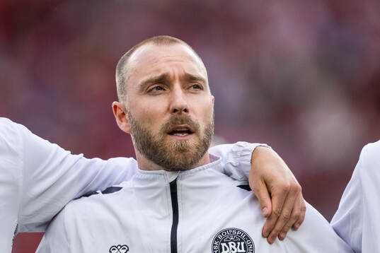 Christian Eriksen of Denmark sings the national anthem