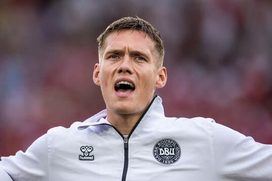 Jannik Vestergaard of Denmark sings the national anthem
