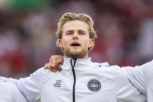 Morten Hjulmand of Denmark sings the national anthem