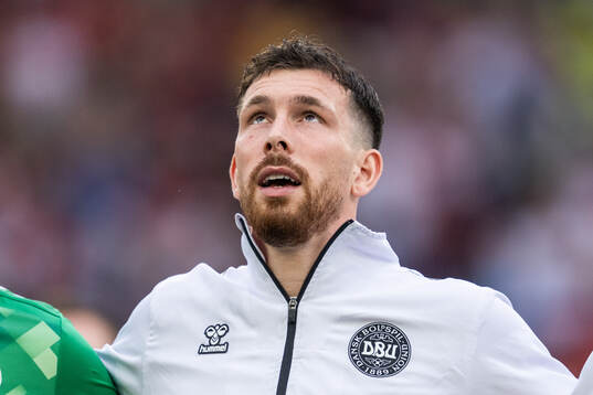Pierre-Emil Højberg of Denmark sings the national anthem