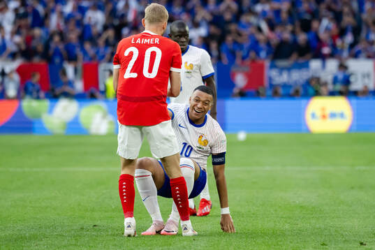 Kylian Mbappé of France and Konrad Laimer of Austria