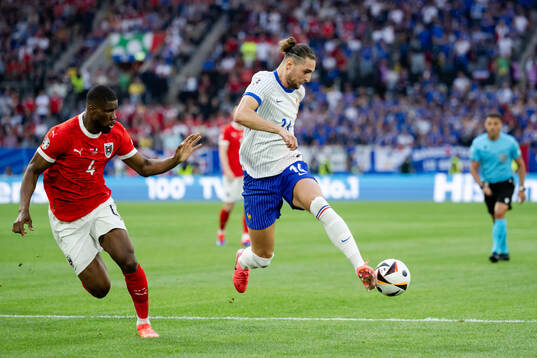 Kevin Danso of Austria and Adrien Rabiot of France