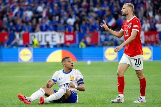 Kylian Mbappé of France and Konrad Laimer of Austria