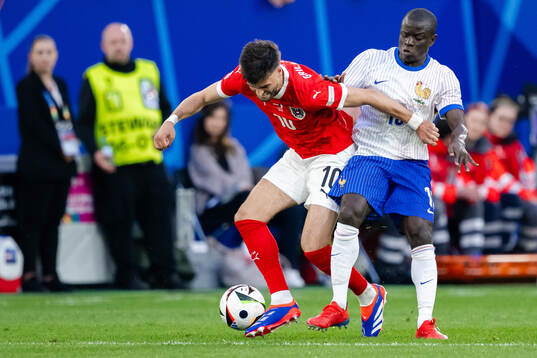 Florian Grillitsch of Austria and N'Golo Kanté of France