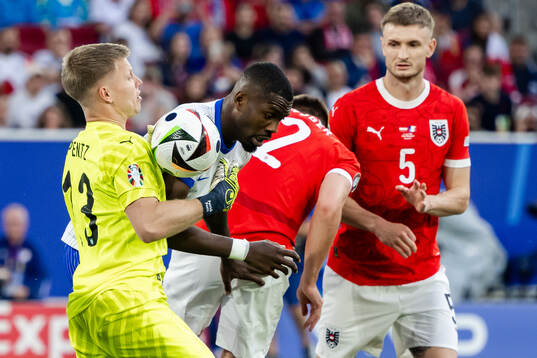Goalkeeper Patrick Pentz of Austria and Marcus Thuram of