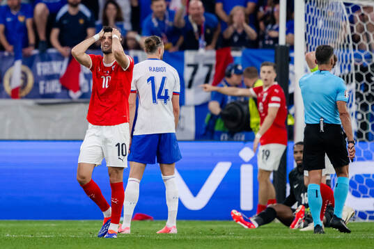 Florian Grillitsch of Austria looks dejected