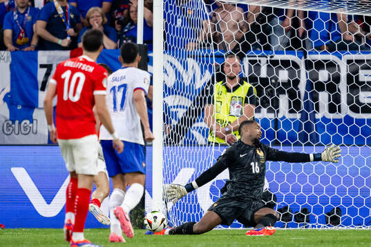 Goalkeeper Mike Maignan of France with a save