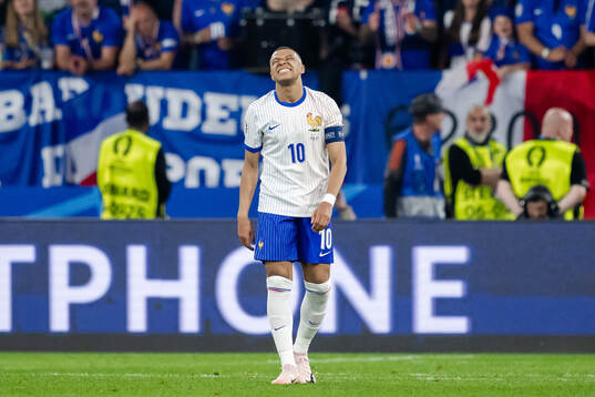 Kylian Mbappé of France looks dejected