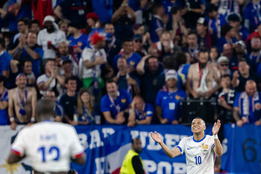 Kylian Mbappé of France looks dejected