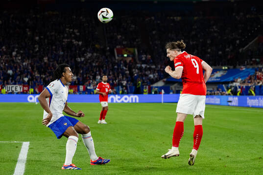 Jules Koundé of France and Marcel Sabitzer of Austria