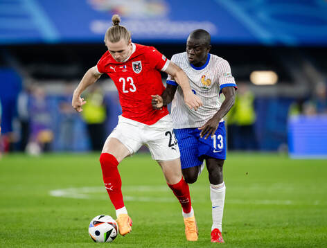 Patrick Wimmer of Austria and N'Golo Kanté of France