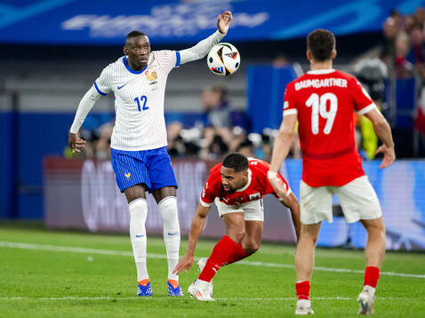Randal Kolo Muani of France and Phillipp Mwene of Austria