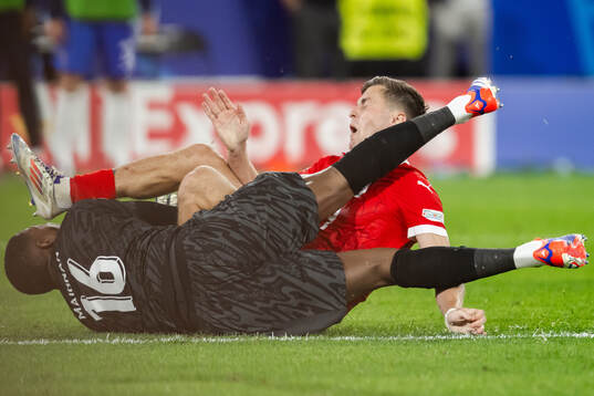 Christoph Baumgartner of Austria and goalkeeper Mike