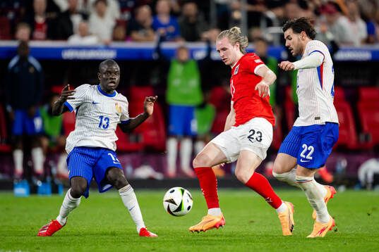 Patrick Wimmer of Austria against N'Golo Kanté and Theo