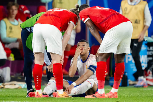 Kylian Mbappé of France in pain