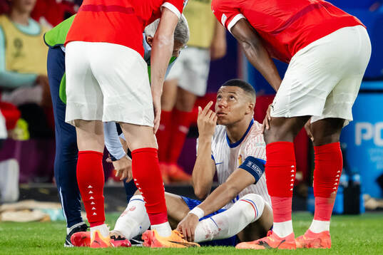 Kylian Mbappé of France in pain