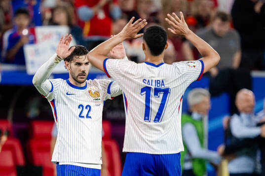 Theo Hernandez and William Saliba of France celebrate