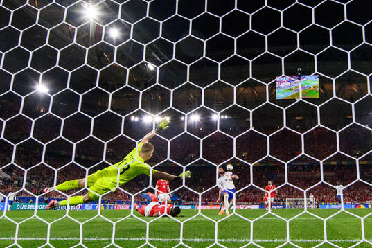 goalkeeper Patrick Pentz of Austria and Olivier Giroud of