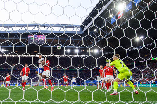 Kylian Mbappé of France against Kevin Danso and goalkeeper