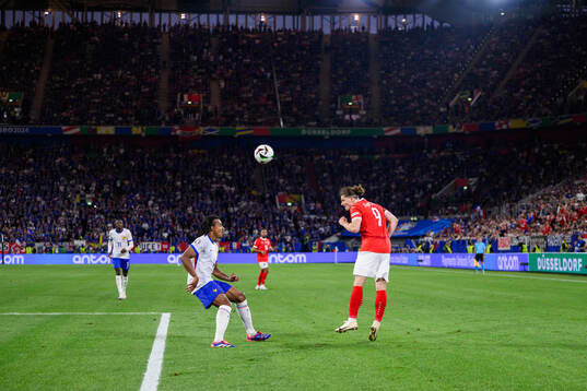 Jules Koundé of France and Marcel Sabitzer of Austria