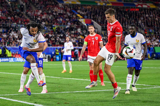 Jules Koundé of France and Christoph Baumgartner of Austria
