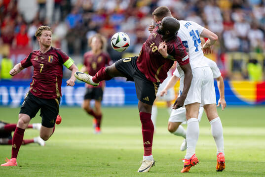 Romelu Lukaku of Belgium and Milan Skriniar of Slovakia