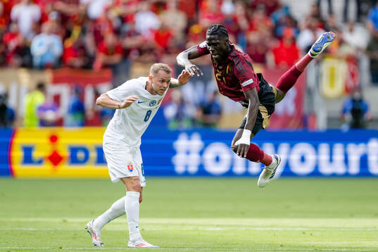 Ondrej Duda of Slovakia and Amadou Onana of Belgium